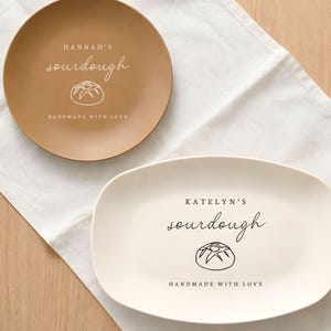 May include: A set of three ceramic mugs with a speckled, matte finish. Each mug features a different color: light blue, cream, and gray. The mugs have a simple, modern design, perfect for coffee or tea.