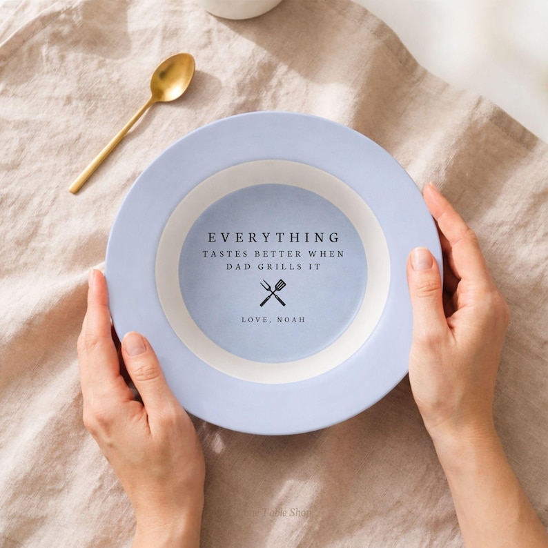 May include: A set of three ceramic mugs with a speckled, matte finish. The mugs are in shades of cream, light gray, and dark gray. Each mug has a simple, minimalist design, perfect for coffee or tea.