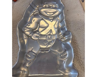 Forma do ciasta Wilton TMNT Michelangelo z 1989 roku, vintage, Żółwie Ninja, aluminium 2105-3075