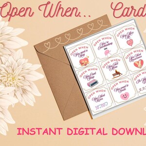 May include: A set of "Open When..." cards with a brown envelope, featuring prompts such as "You need a hug" and "You want to smile." The cards have a vintage design with illustrations and text. The words "Open When... Cards" are at the top.