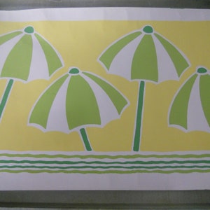 May include: A yellow and white patterned fabric with a repeating design of green and white striped umbrellas. The fabric has a green wavy line at the bottom.