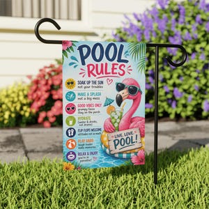 May include: A rectangular garden flag featuring a pink flamingo wearing sunglasses, floating in a pool on a yellow and blue inner tube. The text reads POOL RULES, LIVE. LOVE. POOL!, and lists six rules with icons including a sun, drink, and flip flops.