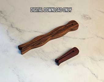 May include: Two dark brown wooden clothespin-shaped objects with visible wood grain patterns. The larger object is elongated and wavy, while the smaller one is short and straight. The text DIGITAL DOWNLOAD ONLY is centered above the objects.