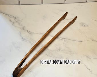 May include: A pair of long, slender wooden kitchen tongs featuring a dark brown wood grain pattern and a curved handle design. The text "DIGITAL DOWNLOAD ONLY" is printed in black letters on the surface near the center of the tongs.