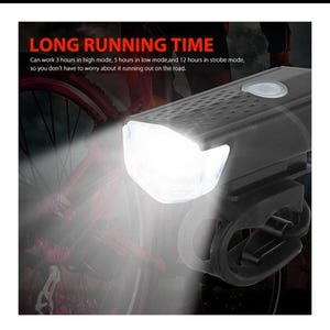 May include: Black bicycle headlight with a bright white light. The text "LONG RUNNING TIME" is visible. The light can work for 3 hours in high mode, 5 hours in low mode, and 12 hours in strobe mode.