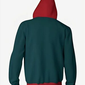 May include: A teal hoodie with a red hood and hem. The back view of the hooded sweatshirt shows the contrast between the teal body and the red accents. The hoodie is made of a soft material.
