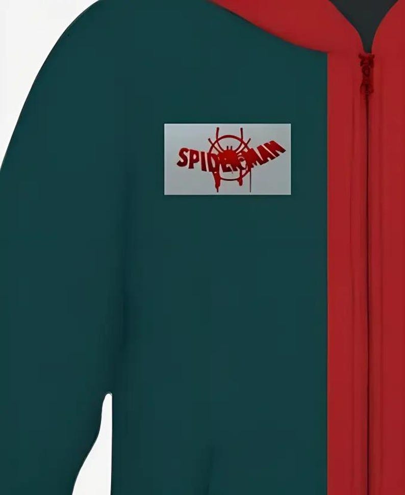 May include: A teal and red jumpsuit featuring a red zipper and a rectangular patch with the words "Spider-Man" and a spider web graphic in red. The jumpsuit is a solid teal color with a red stripe down the front.