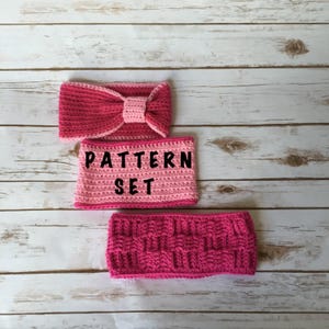 May include: Three pink crocheted headbands, one with a bow, one with a striped pattern, and one with a woven pattern. The headbands are arranged on a white wooden surface. The text "PATTERN SET" is printed on the headband with the striped pattern.