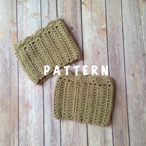 May include: Two crocheted beige leg warmers on a wooden background. The text "PATTERN" is written in white on the wood.