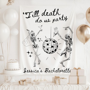 May include: White fabric banner with black text that reads "'Till death do us party" and "Jessica's Bachelorette". The banner features a skeleton bride and groom dancing near a disco ball. White and gold balloons and gifts are in the background.