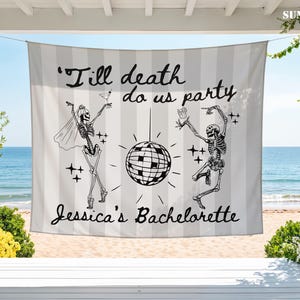 May include: A rectangular fabric banner featuring a light gray and white vertical striped pattern. The design includes two dancing skeletons, a central disco ball, and the black text 'Till death do us party' and 'Jessica's Bachelorette'.
