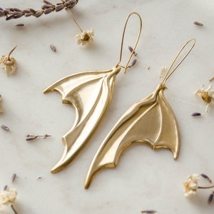gold bat earrings, long batwing charm earrings, gothic witchy Halloween spooky weird earrings, statement jewelry