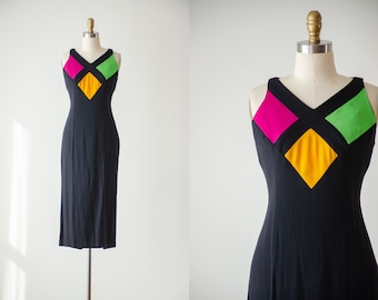 sleeveless black dress | 80s 90s vintage Linda Segal hot pink green yellow neon nipped waist party cocktail wiggle midi dress