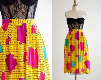 gele vintage rok knielengte jaren 80 warmroze abstracte rok met abstract patroon