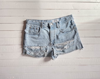 cut off jean shorts | 90s vintage distressed thrashed frayed soft faded daisy dukes short denim shorts