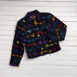 rainbow fringe jacket 90s vintage Kindred Spirits black woven boho tassel jacket