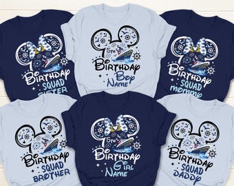 May include: A collection of navy blue and light blue t-shirts with a cruise ship design. Each shirt features a Mickey Mouse head outline with a bow, the words "Birthday Squad" and a role like "Sister" or "Mommy". The shirts are for a 5th birthday.