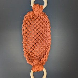 May include: A white ceramic mug with a black handle and the text "But First, Coffee" in a handwritten style. The mug is on a white surface. The mug is 4 inches tall.