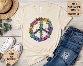 May include: A cream-colored t-shirt featuring a central graphic of a peace sign formed by colorful flowers and green leaves against a purple circular background. The shirt includes text in the corner stating DTF & SUBLIMATION TRANSFER TRANSFER ONLY.