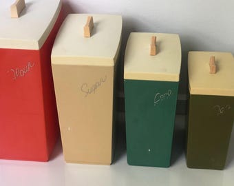 Juego de cuatro botes de cocina Capri vintage de mediados de siglo, de tamaño gradual.