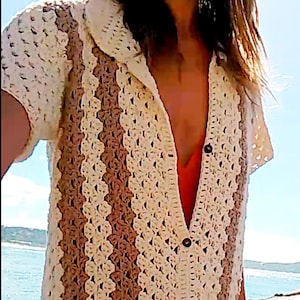 May include: A cream and brown crochet shirt with a collared neckline and button closure. The shirt features vertical stripes and the text "UknitMe2". A PDF logo is visible in the bottom right corner.