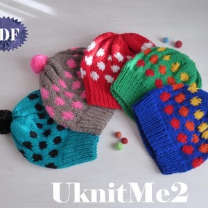 May include: Four colorful knitted hats with different patterns. The hats are made with a variety of colors, including red, green, blue, and pink. Each hat has a pom-pom on top. The hats are arranged in a row on a white surface.  UknitMe2