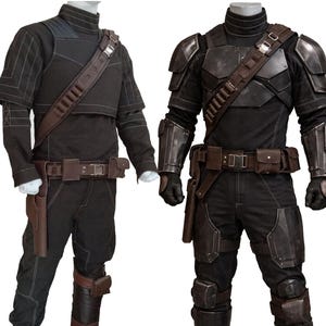 May include: Two black tactical outfits on mannequins. One features a short-sleeved top with a brown belt and holster. The other has armor plating on the shoulders, arms, and legs, with a similar belt and holster. Both have a high collar.