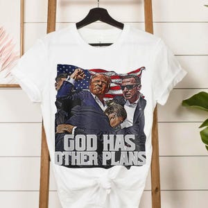 Patriotic Trump Graphic Tee: God Has Other Plans, American Flag - Conservative Christian Gift