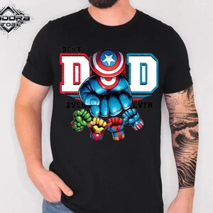 A black t-shirt with a graphic design featuring a superhero character and the text "Best Dad Ever" printed on it.
