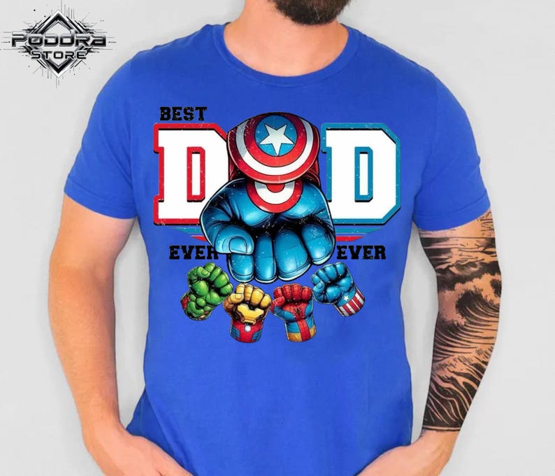 A blue t-shirt with a graphic design featuring a superhero character and the text "BEST DAD EVER" printed on it.