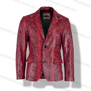 May include: A red snakeskin-patterned blazer with two front pockets and a two-button closure. The jacket has a notched lapel and a black lining. The brand name "SCORPION HIDE CO" is printed on the jacket.