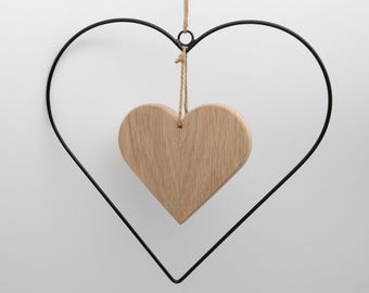 Metal heart, decorative heart with wooden heart