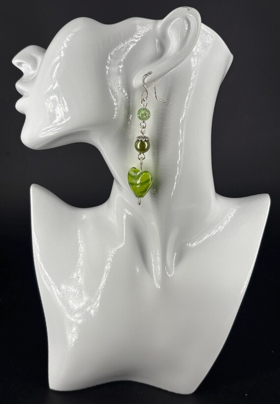 Large, light green heart earrings, made from glass beads