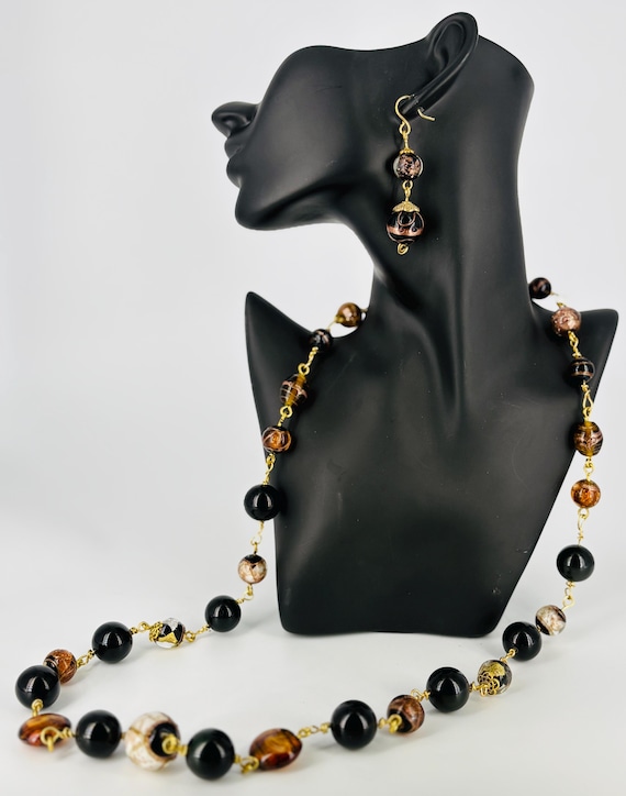 Striking black, gold, brown and white big bead statement necklace.