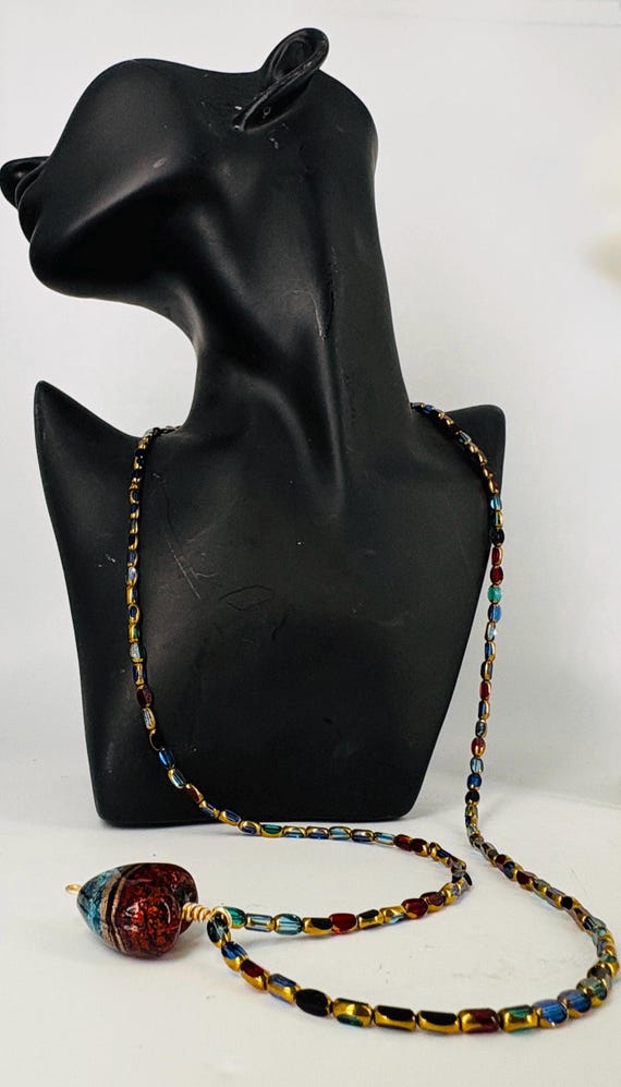 Heart pendant necklace of small blue red and gold Czech beads, large red and blue heart pendant