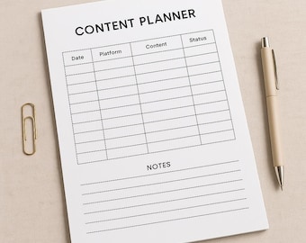 May include: A white Content Planner notepad with a grid for tracking content details. The notepad has the title "CONTENT PLANNER" at the top, with sections for Date, Platform, Content, and Status. A beige pen and a gold paperclip are also in the image.