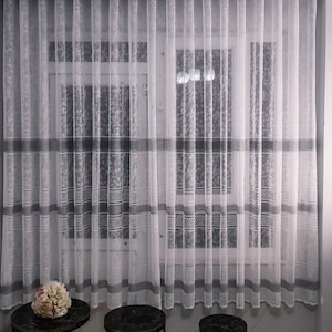 Elegant pre-pleated sheer curtains for a dining room