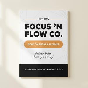 May include: A white ADHD calendar and planner with the text "FOCUS 'N FLOW CO." in bold black letters. The cover also includes the text "ADHD CALENDAR & PLANNER" and the quote "Find your rhythm. Flow in your own way."