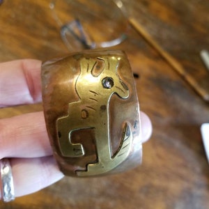 Signed copper dog bracelet