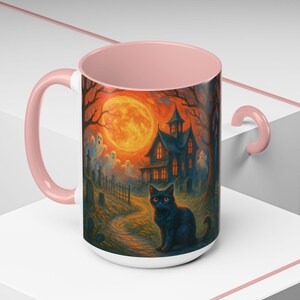 A spooky Halloween mug design featuring a glowing orange moon, eerie ghosts drifting near a gothic haunted house, and a black cat with fiery orange eyes sitting in a graveyard path. Perfect for Halloween lovers, witches, and gothic décor fans, this mug makes a unique fall kitchen piece or haunted holiday gift. Works for coffee, tea, or cocoa. Original design by The Haunted Hollow Co.™.