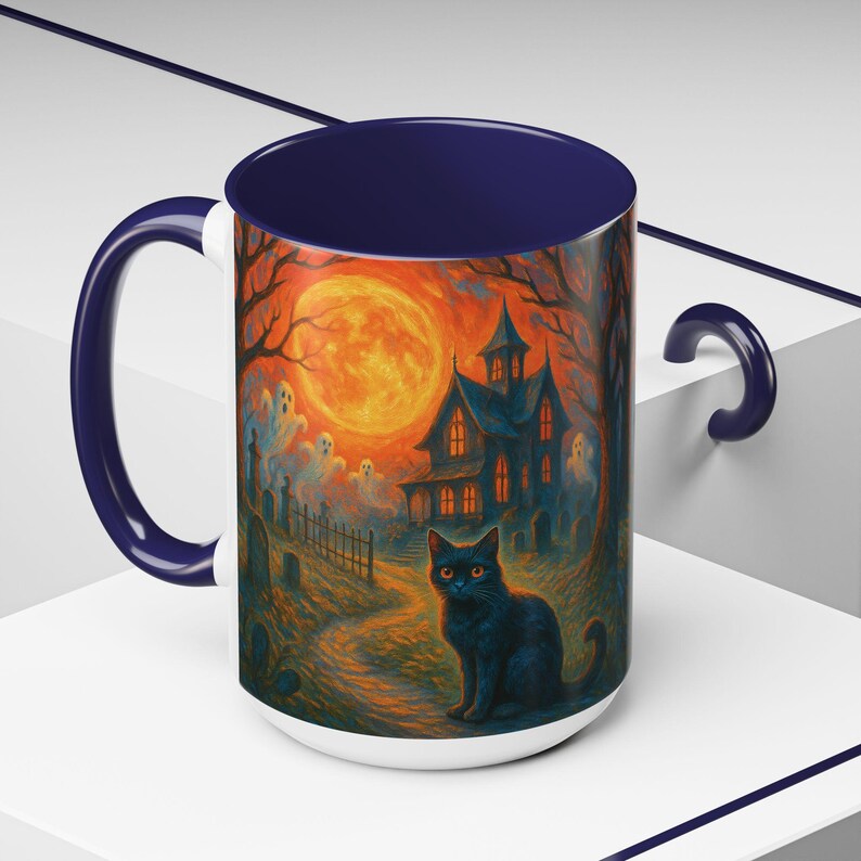 A spooky Halloween mug design featuring a glowing orange moon, eerie ghosts drifting near a gothic haunted house, and a black cat with fiery orange eyes sitting in a graveyard path. Perfect for Halloween lovers, witches, and gothic décor fans, this mug makes a unique fall kitchen piece or haunted holiday gift. Works for coffee, tea, or cocoa. Original design by The Haunted Hollow Co.™.