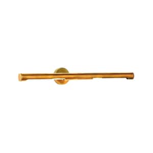 May include: A gold-colored, horizontal wall-mounted light fixture. The fixture has a circular base and a long, cylindrical bar. The light is designed to be mounted on a wall and provides illumination.