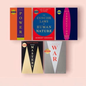 May include: A collection of five books by Robert Greene, including The 48 Laws of Power, The Concise Laws of Human Nature, The Art of Seduction, Mastery, and The 33 Strategies of War. Each book cover features distinct bold colors and geometric designs.