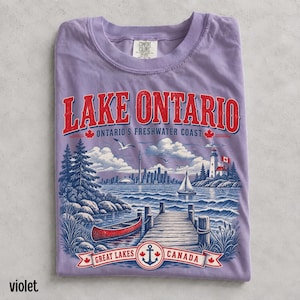 Vintage Lake Ontario Canada shirt in ivory featuring detailed Great Lakes shoreline, pine trees, Toronto skyline and nautical artwork.