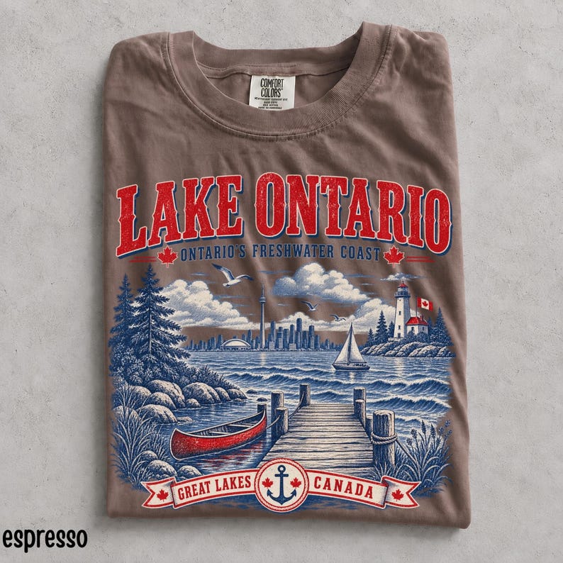 Woman wearing oversized espresso Lake Ontario Comfort Colors shirt with vintage Canada Great Lakes waterfront graphic.
