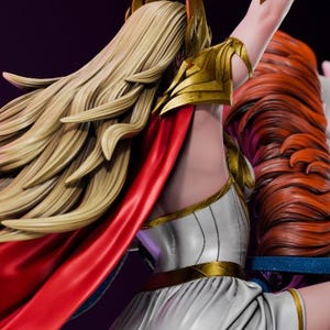 May include: A detailed figurine of a character riding a white horse with large, colorful wings. The character wears a white dress, red cape, and gold armor, holding a sword. The horse has blue and purple accents.