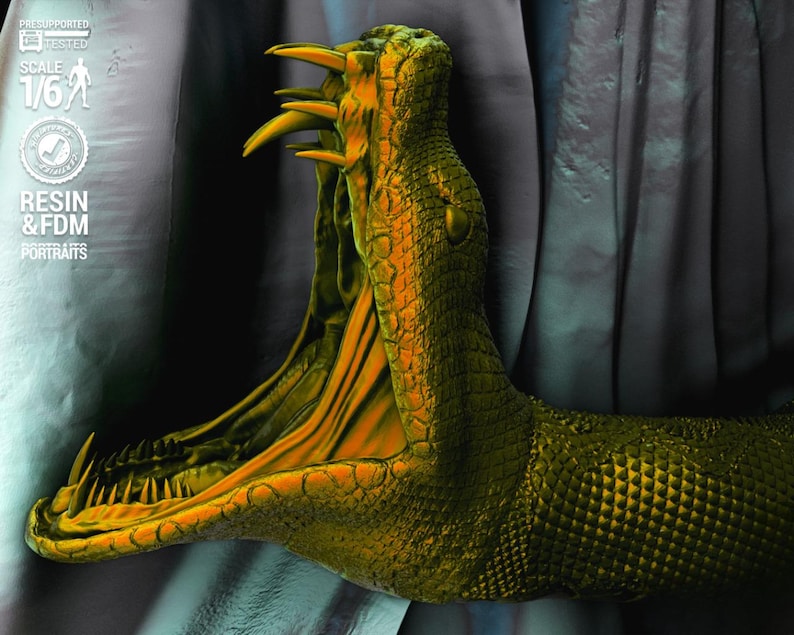 May include: A detailed sculpture of a snake's head with an open mouth, showcasing sharp teeth and a vibrant orange interior. The snake's scales are a textured green and yellow. The image includes text that reads "PRE-SUPPORTED & TESTED", "SCALE 1/6", and "RESIN & FDM PORTRAITS".