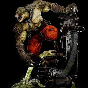 May include: A detailed statue of a reptilian humanoid creature with a menacing expression. The figure is wearing orange pants, a collar, and arm wraps. It is posed next to a brick and metal structure, with green liquid flowing from it.