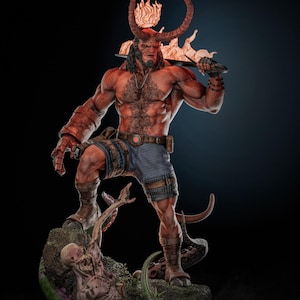 May include: A detailed statue of a red-skinned, muscular figure with horns and a fiery crown, holding a weapon. The figure is wearing denim shorts and stands on a base with a monster and vegetation. The statue has intricate details and a dynamic pose.