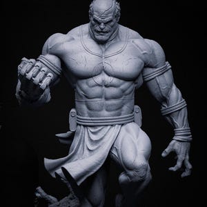 May include: A grey statue of a muscular man in a dynamic pose, with a stern expression and clenched fist. The figure wears armbands, a belt, and a draped garment. The statue has detailed musculature against a dark background.